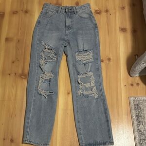Woman’s Relaxed Fit Distressed Blue Jeans